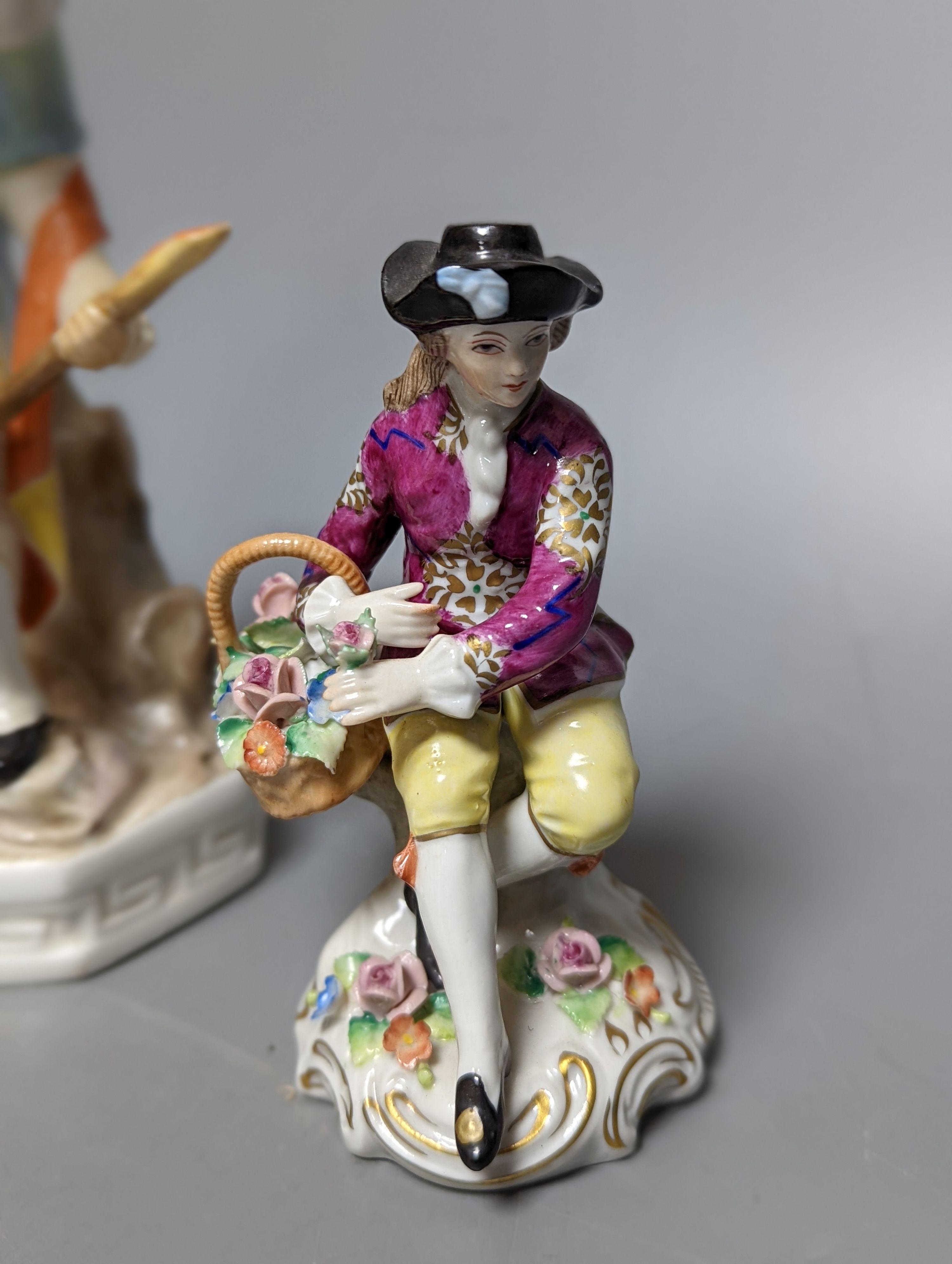 A late 19th century Meissen figure of a boy holding a garland of flowers, and a Sampson Hancock Derby figure and three other continental porcelain figures, tallest 18 cms high.